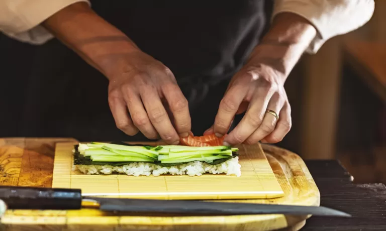 making Japanese sushi roll
